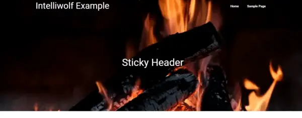 a website showing a transparent header with a fire in the background