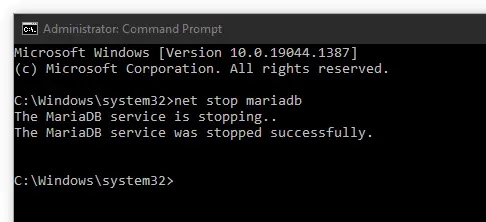 administrator command prompt showing successful execution of net stop mariadb
