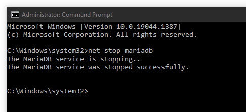 administrator command prompt showing successful execution of net stop mariadb