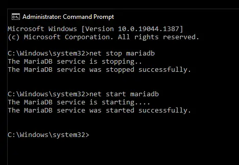 Administrator command prompt showing successful restarting of mariadb