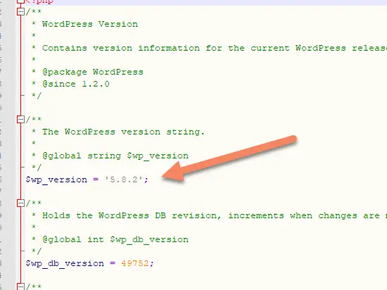 Arrow pointing to $wp_version 5.8.2 in version.php