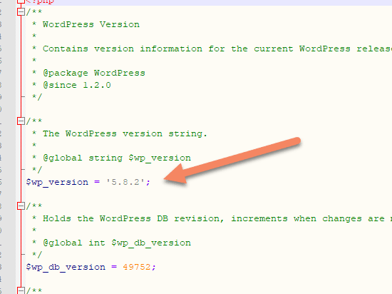 Arrow pointing to $wp_version 5.8.2 in version.php